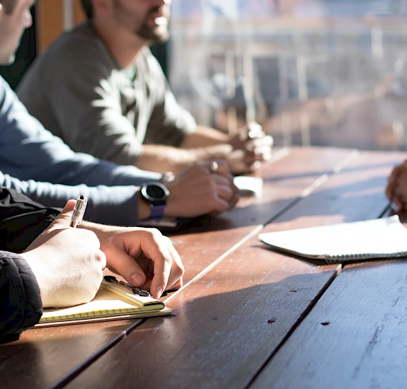 Company employees at the negotiating table